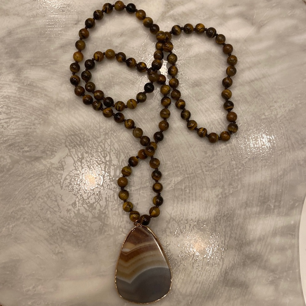 Brown, tan, and blue hues long statement necklace